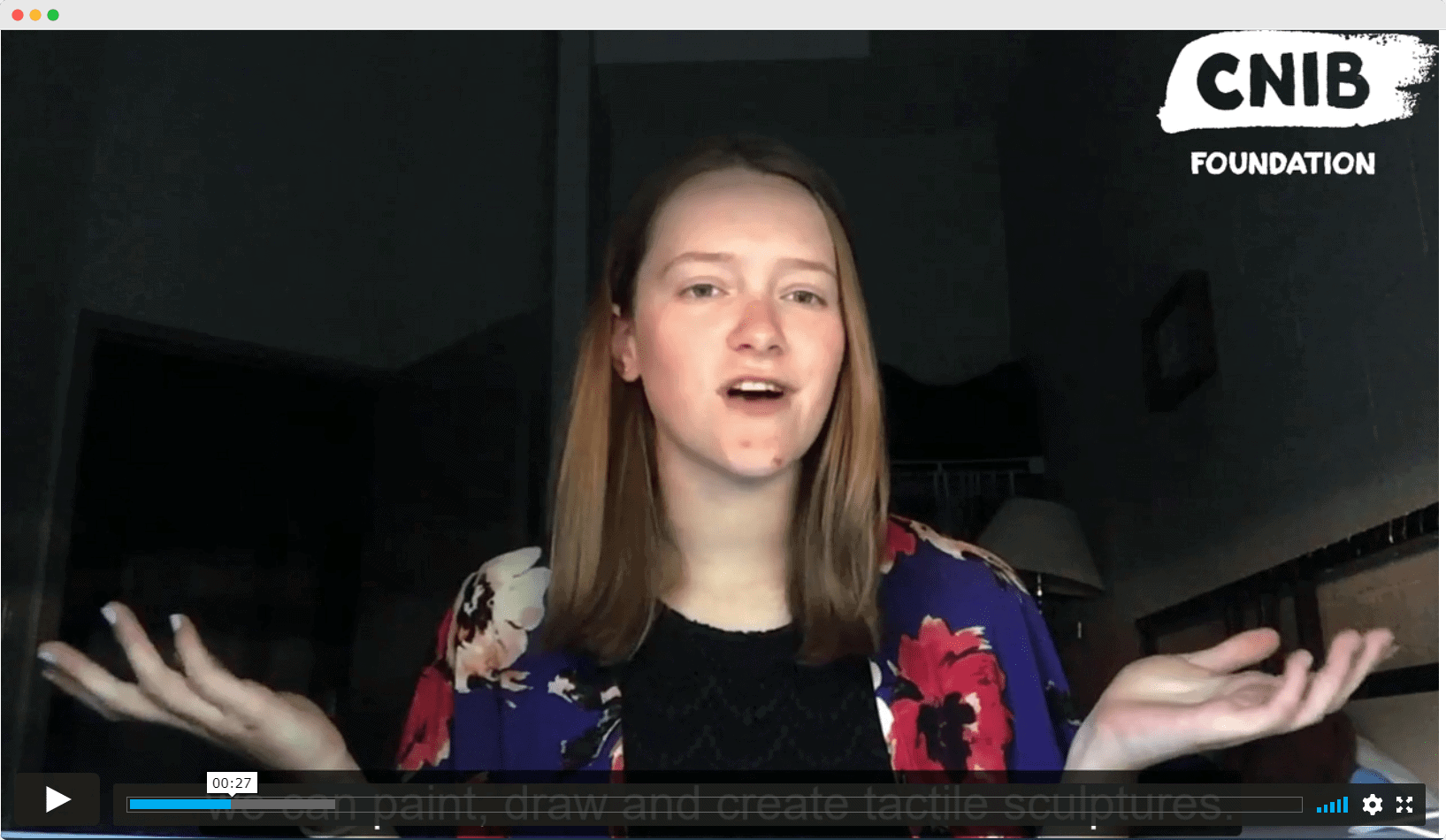 girl speaking in front of camera with hand gestures